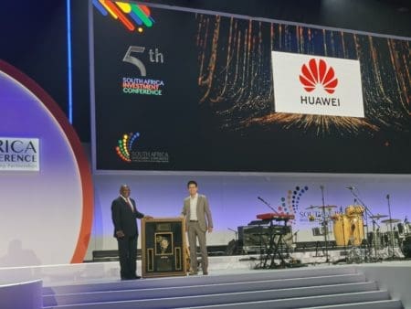 President Cyril Ramaphosa and Huawei Deputy CEO Kian Chen, accepting the award for Huawei
