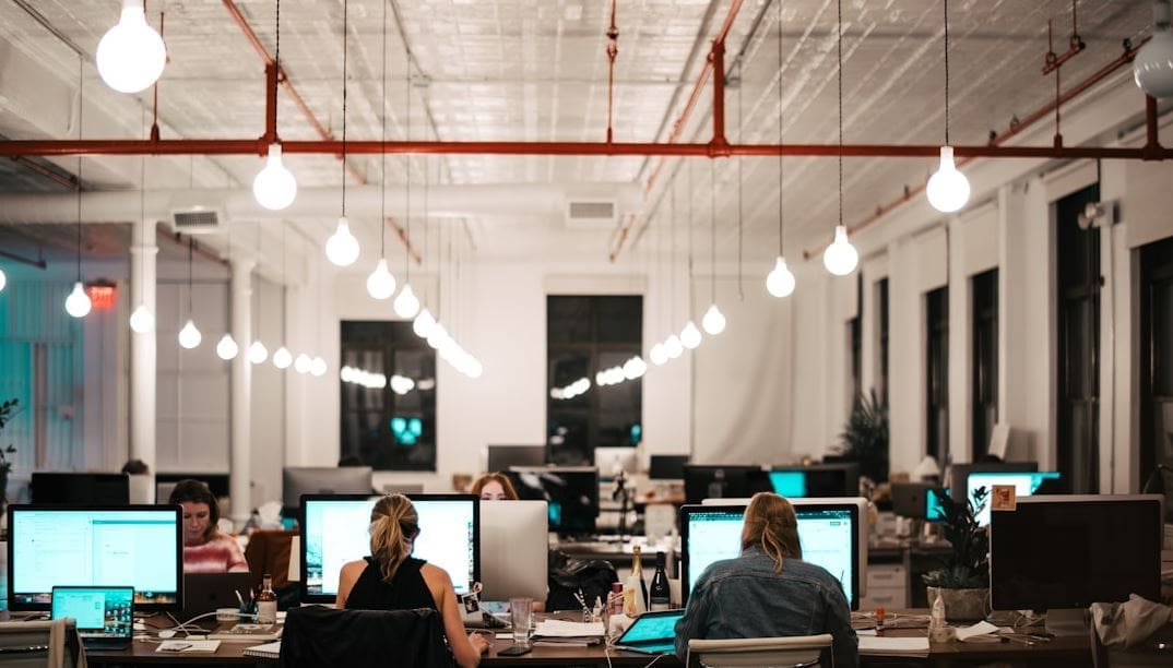 A Group of professionals employs knowledge management to utilize insights from business intelligence effectively.