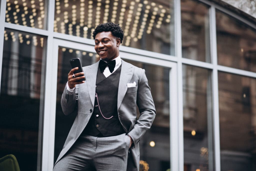 Executive holding a smartphone in his hand