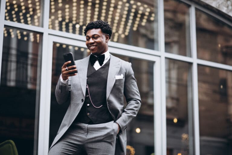 Executive holding a smartphone in his hand