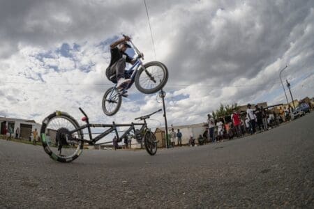 Hloni Ramaila, a BMX rider, jumps over a spinning customised bike in the streets of Soweto during a meetup over the weekend. This cycling subculture was born out of the more commonly known car “stance” culture.