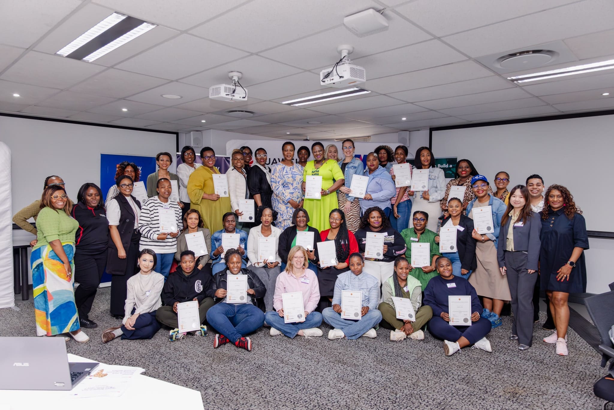 Women in Tech participants, receiving certificates -min