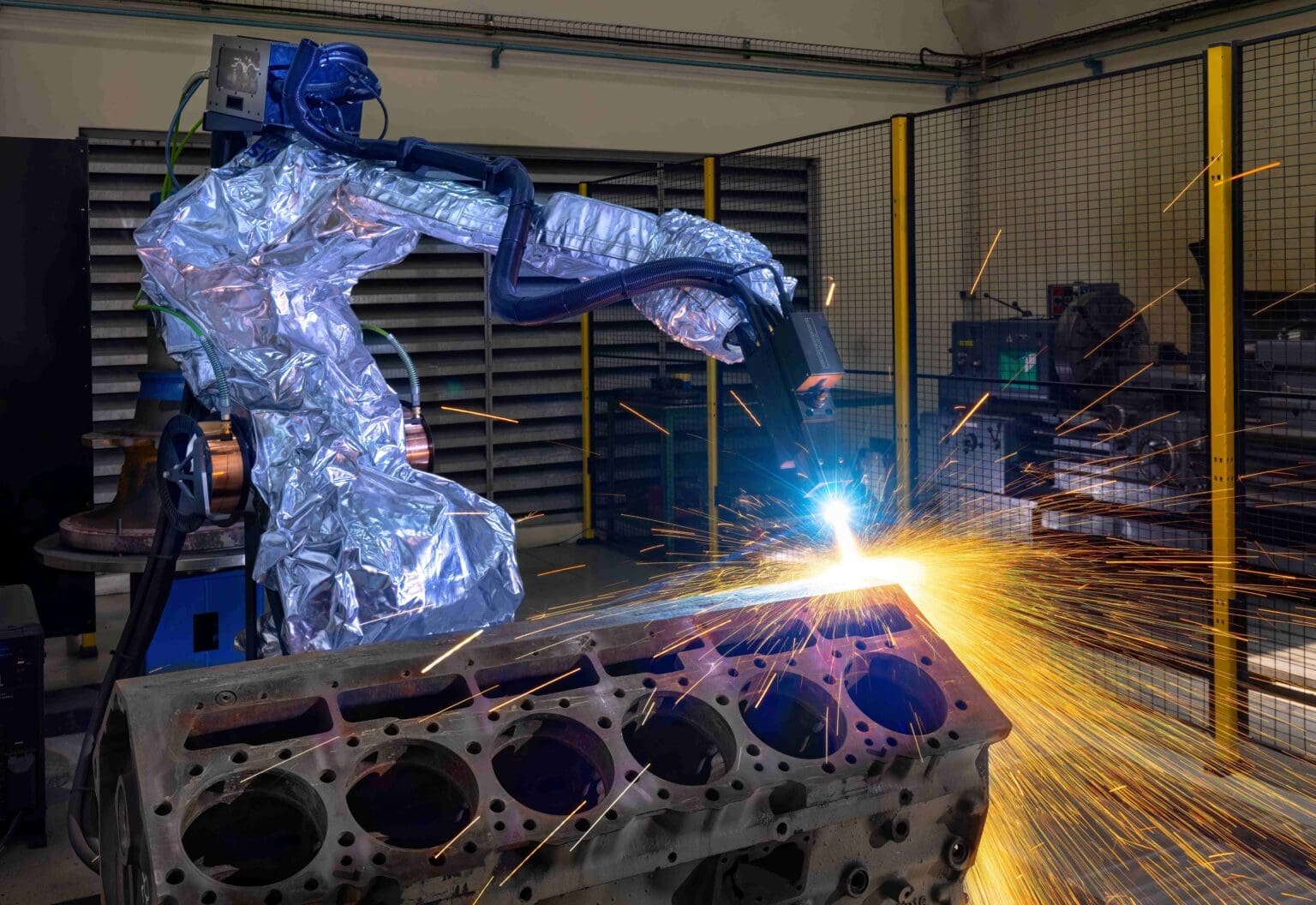 Robotic Arc-spray on the top decks of a C32 block