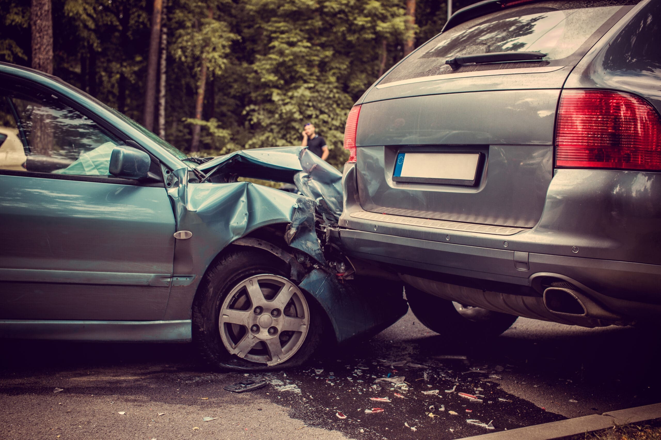 Close up smached cars on a road.