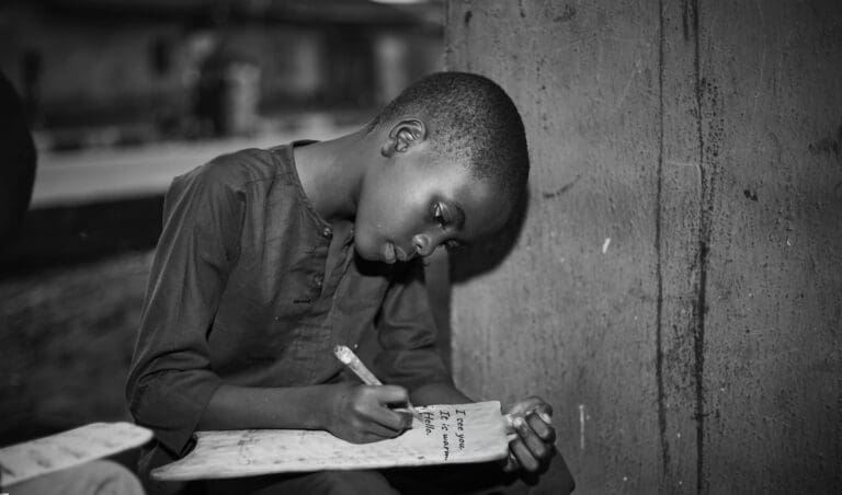 South Africa’s AI future Is Leaving Millions Behind Young boy writing